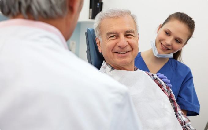 Senior man smiling at his Moorestown New Jersey dentist