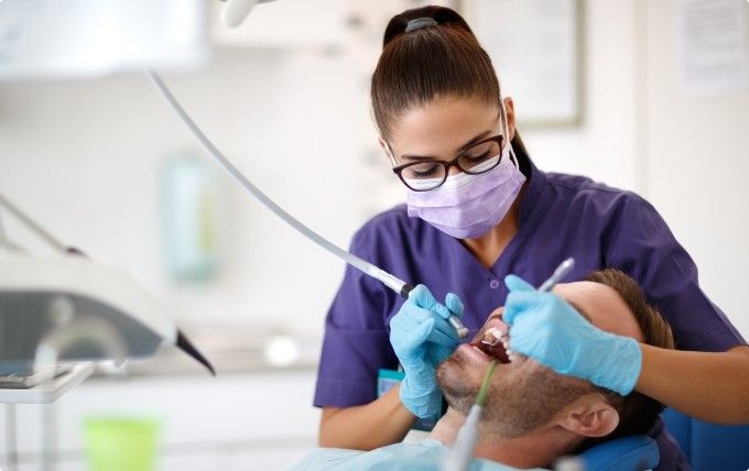 Dentist treating a dental patient